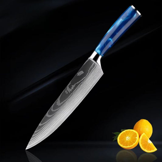 An 8" Razor Sharp Blue Chef Knife with a Damascus steel blade and a sleek blue resin handle, elegantly displayed with fresh oranges on a black reflective surface.