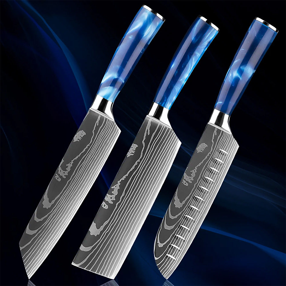 A set of three high-quality kitchen knives with Damascus-style blades and blue resin handles, including a Kiritsuke, Nakiri, and Santoku knife, displayed against a dark blue gradient background.