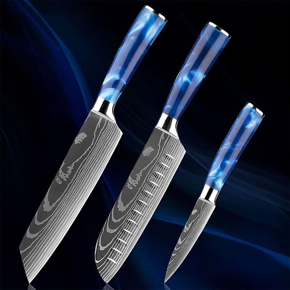 A set of three premium kitchen knives featuring Damascus-style blades and striking blue resin handles, including a Kiritsuke, Santoku, and Paring knife, displayed against a dark blue gradient background.