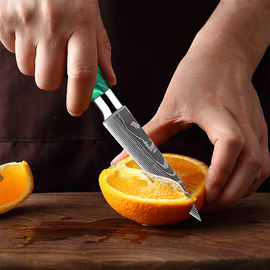 The Kitchen Knives - Razor Sharp Green 5" Paring Knife is designed for precision cutting, peeling, and intricate kitchen tasks. Its razor-sharp high-carbon stainless steel blade ensures clean, effortless cuts, while the ergonomic green resin handle provides a comfortable, non-slip grip. A must-have for every kitchen. Available at: https://www.greengrillshop.com/products/kitchen-knives-razor-sharp-green.