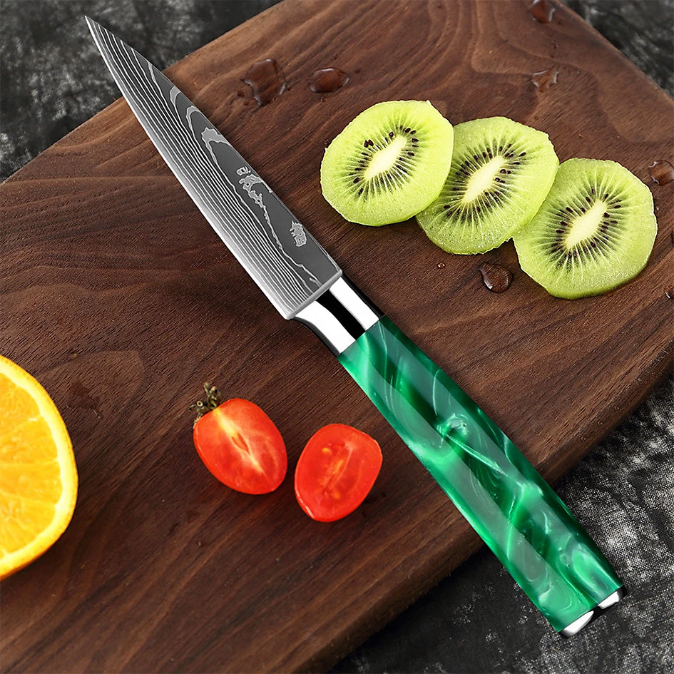 The Kitchen Knives - Razor Sharp Green 5" Utility Knife is crafted for precision and versatility, perfect for slicing fruits, vegetables, and small cuts of meat. Featuring a razor-sharp high-carbon stainless steel blade and an ergonomic green resin handle, this knife provides effortless control and a sleek aesthetic. Available at: https://www.greengrillshop.com/products/kitchen-knives-razor-sharp-green.