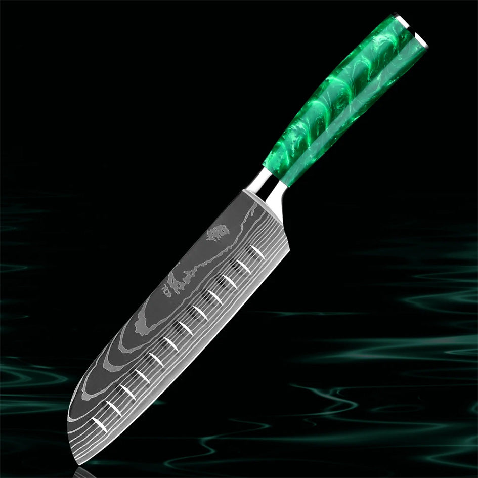 The Kitchen Knives - Razor Sharp Green 7" Santoku Knife is perfect for slicing, dicing, and mincing with precision. Crafted from high-carbon stainless steel, its razor-sharp blade ensures effortless cutting. The ergonomic green resin handle offers a comfortable, non-slip grip for superior control. A versatile tool for any kitchen. Available at: https://www.greengrillshop.com/products/kitchen-knives-razor-sharp-green.
